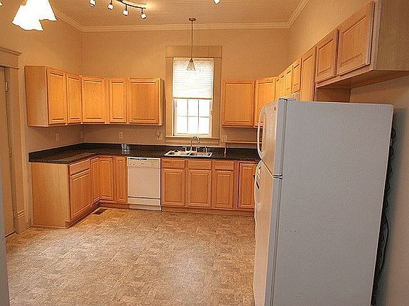 Kitchen with unique lighting and all appliances