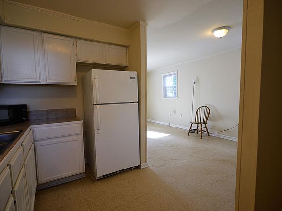 Kitchen opens to breakfast nook/living area