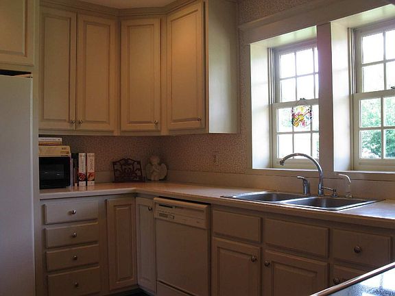 Replacement double hung windows, lots of cabinet space, all-wood cabinets