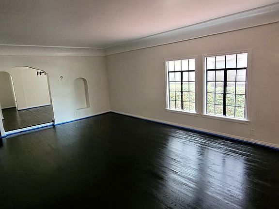 Living Room with gorgeous front windows facing 1st street. Newly redone floors.