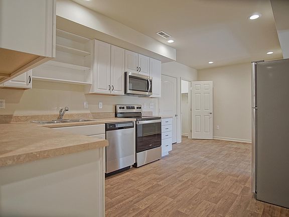 Full downstairs kitchen/dinning area with fridge, range, dishwasher and microwave.