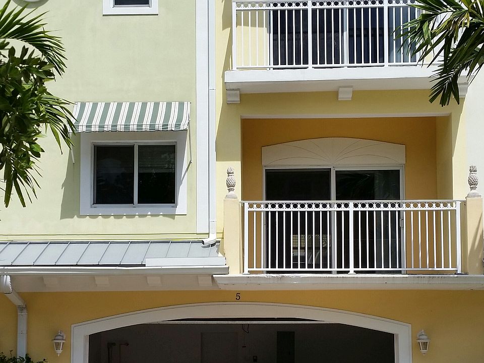 two-car garage with capacity for four additional cars in the