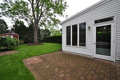 nice patio area leading to sunroom