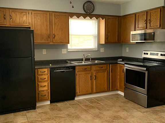 A new fridge with ice maker, new dishwasher, new garbage disposal, new electric stove, new microwave, and new ceiling fan have been installed.