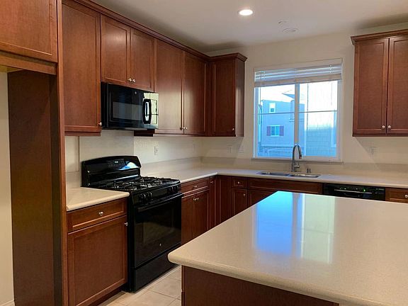 Kitchen has brand new oven, stove, and microwave, has also an island and a large storage closet.