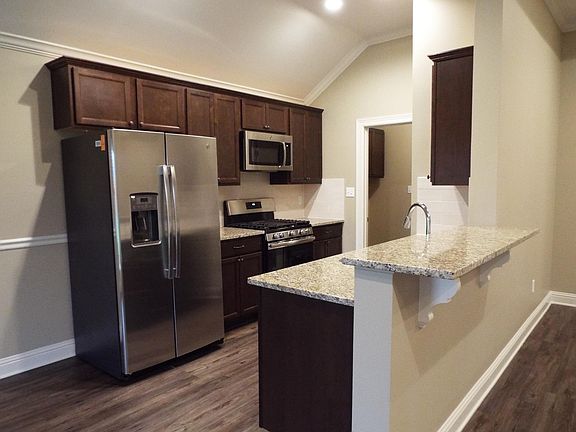 Kitchen with granite countertops and stainless steel appliances