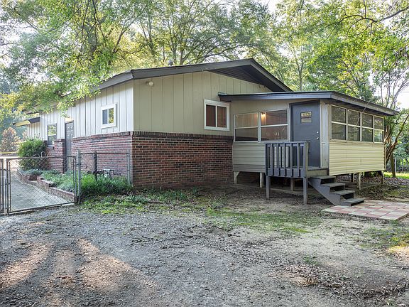 Drive thru gate to access back yard and shop.