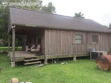 Pool House
						:
						This front porch is also on the pond