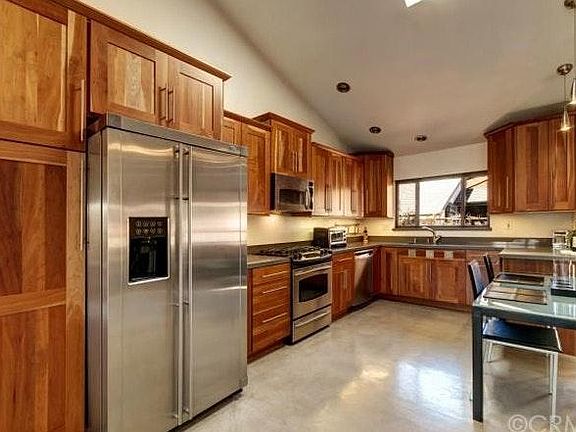 Contemporary kitchen with SS appliances, built-in wine coole