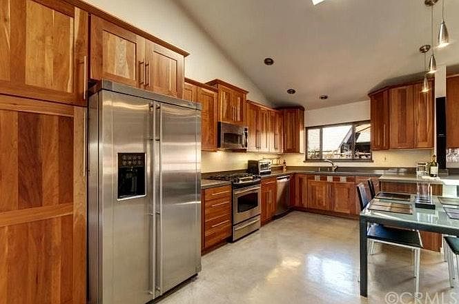 Contemporary kitchen with SS appliances, built-in wine coole