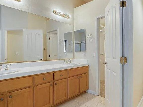 Master bedroom bathroom with walk-in closet and separate water closet.