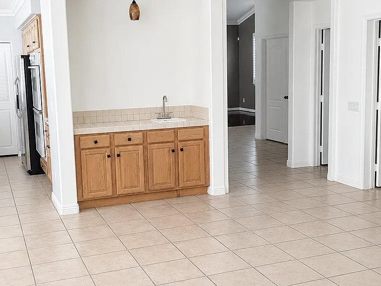 Convenient built-in cabinet and wet bar area near the main living space
