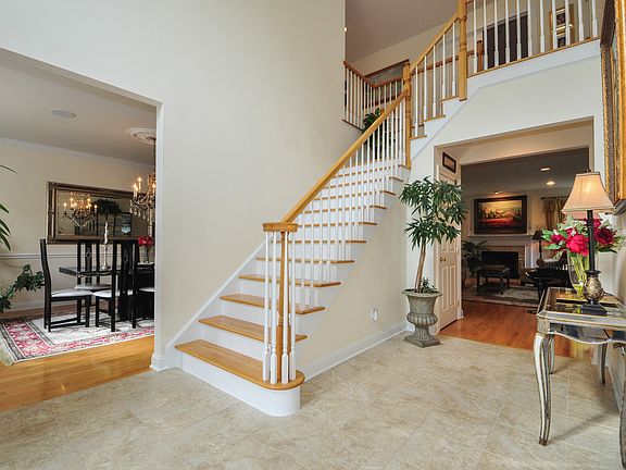 Who wouldn't want to come into this high ceiling foyer. Step into comfort and beauty.