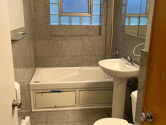 bathroom with a linen closet.