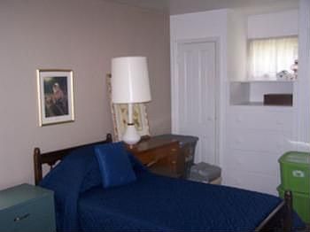 Main floor master bedroom with hardwood floors.