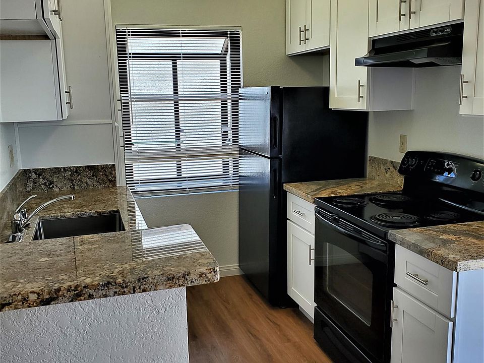 Kitchen with new cabinets, countertops, paint and flooring.
