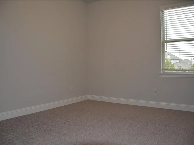 NATURAL LIGHT ABOUNDS AND WINDOW BLINDS ARE INCLUDED