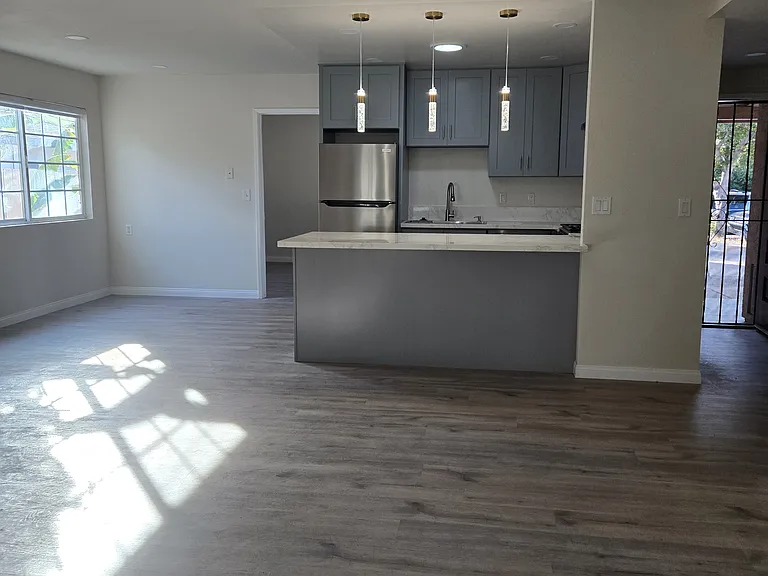 View of the kitchen/ dining area and front gated door