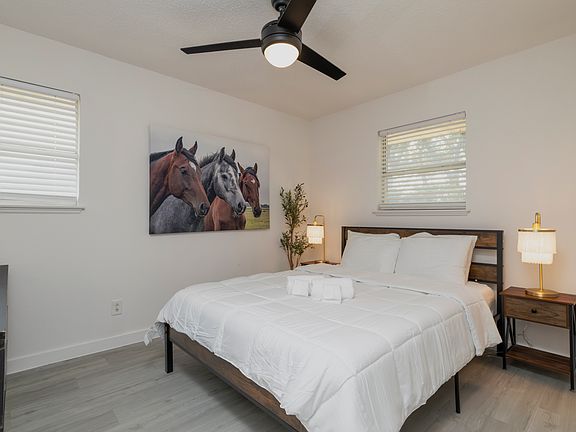 Bedroom #1 with attached full bath and queen bed.