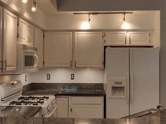 side by side refrigerator freezer with ice and water dispenser.