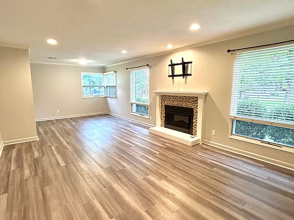 View of living room and optional dining area in the back