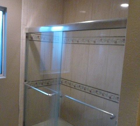 Shower over tub with enclosure