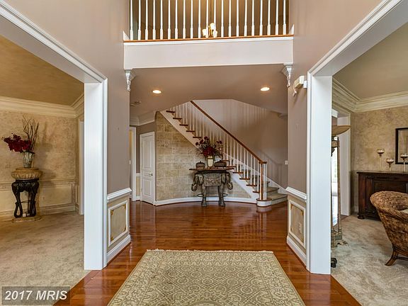 Grand two story foyer with curved staircase