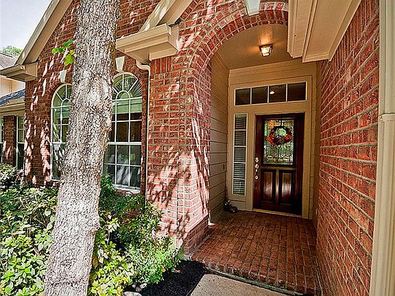 Covered front porch provides shelter for visiting guests-notice the leaded glass front door!