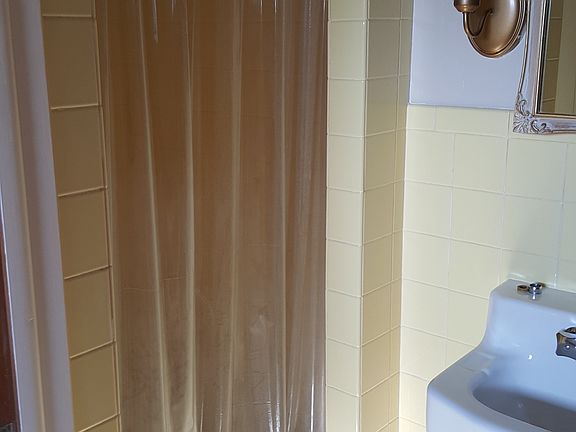 Bathroom with tiled shower