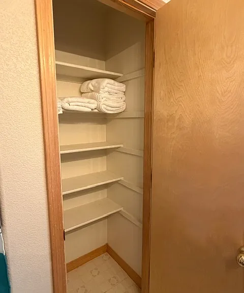 Abundant storage in the shared bathroom.