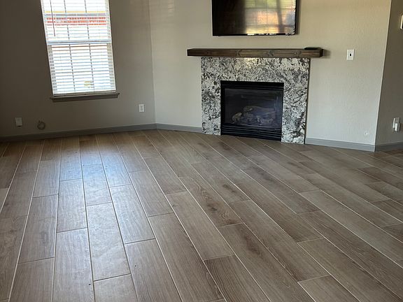Living Room, Gas fireplace with wall mounted television.