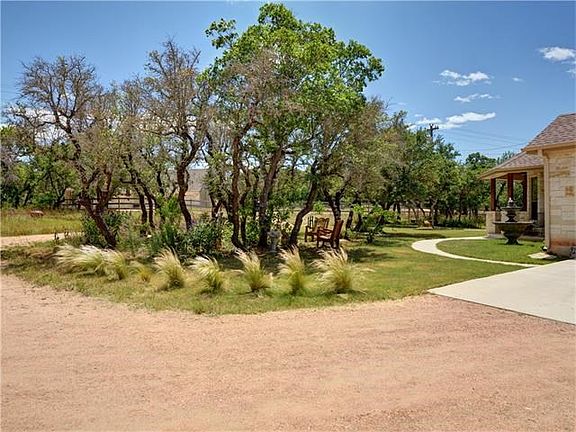 One of many seating areas to choose from. Relax under the trees near the fountain, find seclusion in