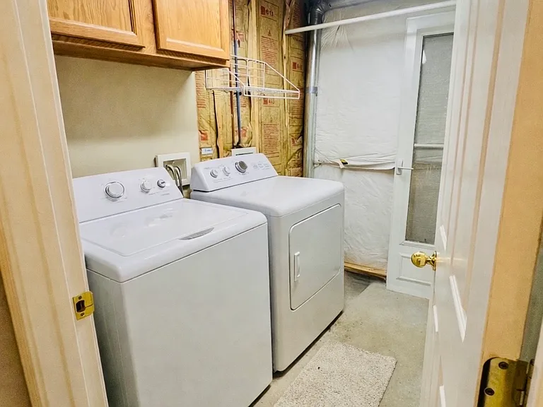 Laundry area, virtually staged to show washer/dryer placement. *Washer and dryer not included*