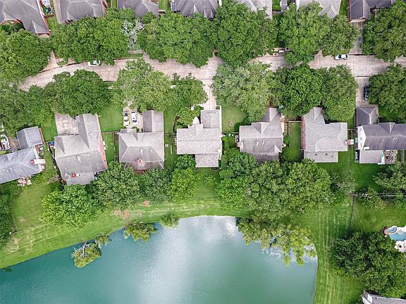 Another aerial view of the home showing off the large pond.