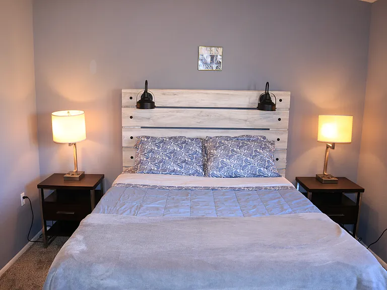 Queen size bed with memory foam in the main bedroom.