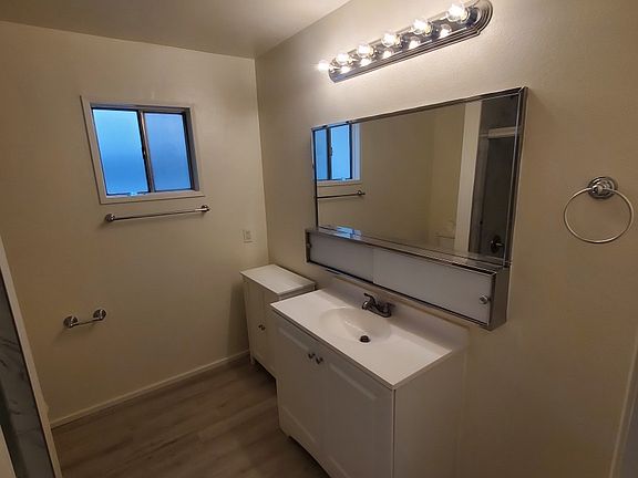All updated new master bath with new tub and porcelain tiles to ceiling including new frosted privacy glass sliding doors