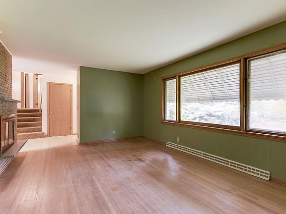 Very spacious front facing living room with see-through fireplace
