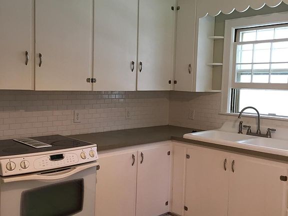 Kitchen with ceramic floor and backsplash
