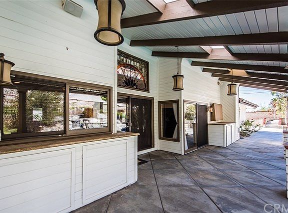 Extensive covered backyard patio - perfect for your entertainment needs!