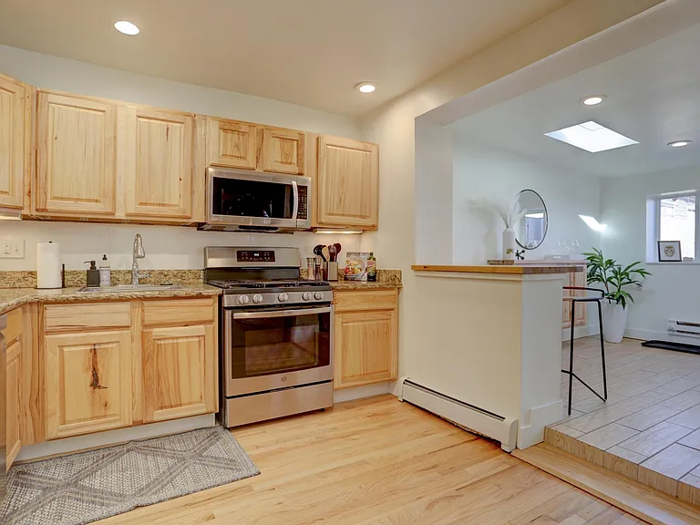 Kitchen with view of entertainment area/ bar.