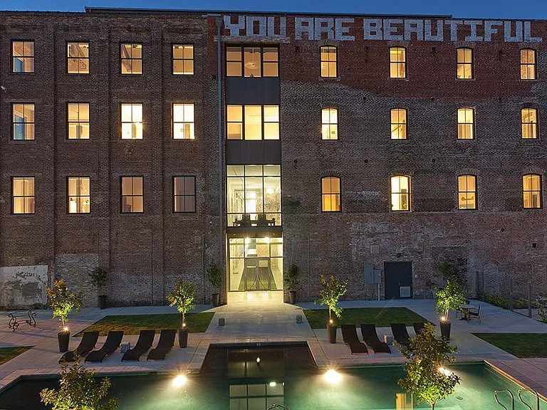 Rice Mill Lofts | You Are Beautiful mural by Banksy