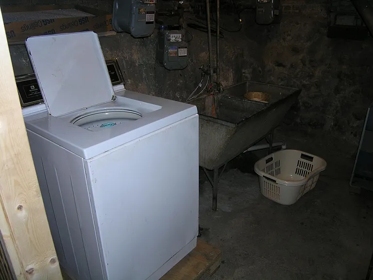 Private basement laundry area.