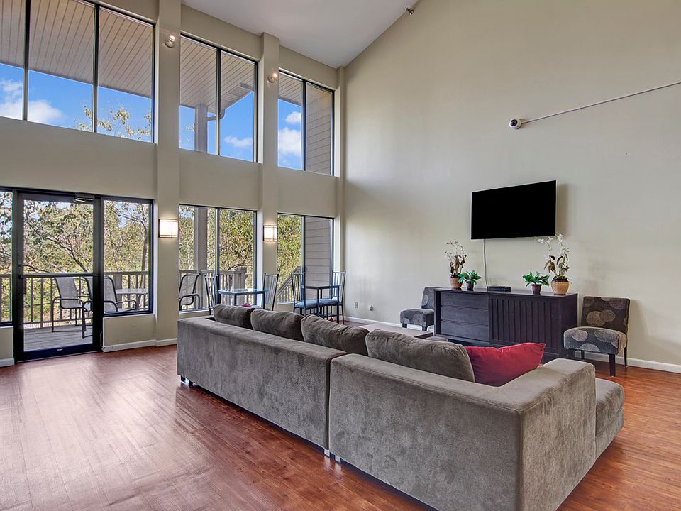 Town Centre Common Area with Outdoor View, Couch, and Television