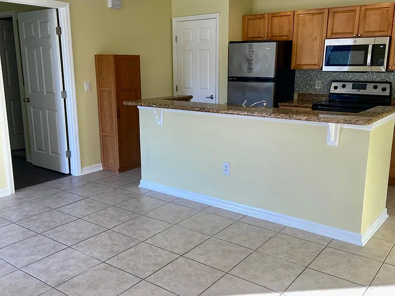 Living room with view of the kitchen