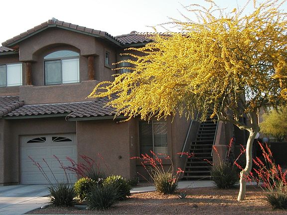 Front of condo and attached garage.