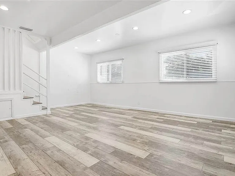Largest of the bedrooms off of the front of the home with recessed lights, luxury vinyl plank flooring, great light and large closets