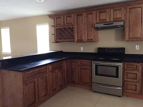 WOOD CABINETS & GRANITE COUNTER