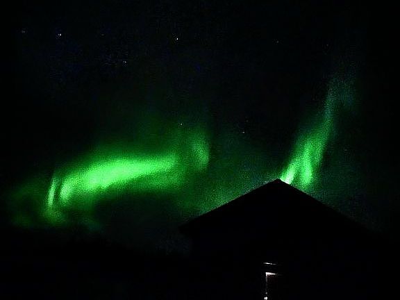 Northern lights over barn