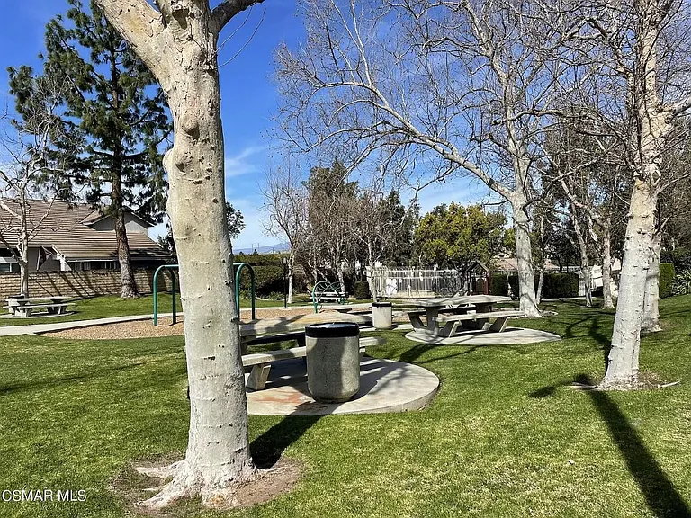 Another angle of quiet community park with gated pool and jacuzzi in the back