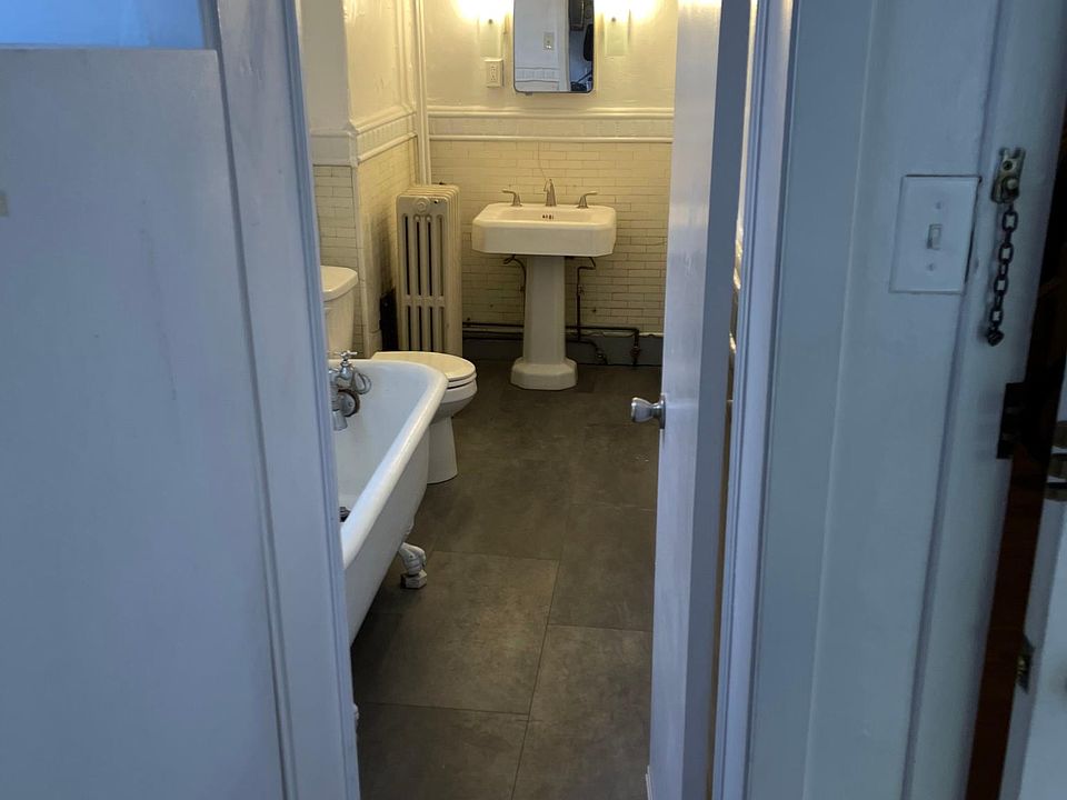 claw foot tub w shower, new flooring, original subway tile